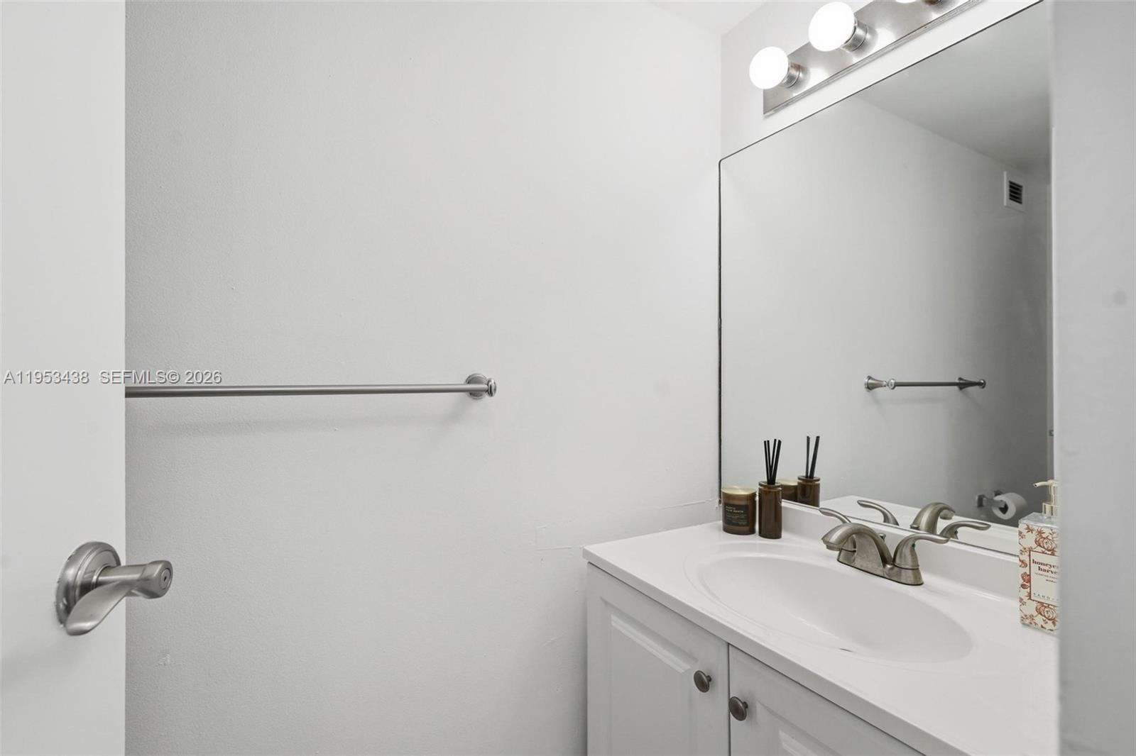 200 Southeast 15th Road, Unit 11H Miami, FL 33129 - Photo 16 of 25 a bathroom with a sink and mirror