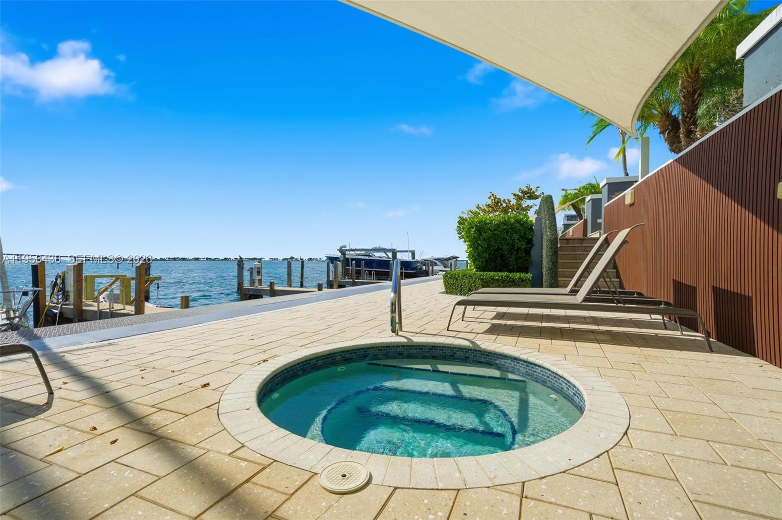 200 Southeast 15th Road, Unit 11H Miami, FL 33129 - Photo 18 of 25 a swimming pool with outdoor seating and barbeque