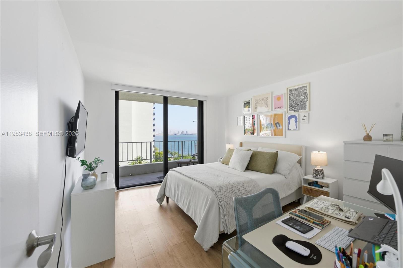 200 Southeast 15th Road, Unit 11H Miami, FL 33129 - Photo 9 of 25 a bedroom with two beds and a large window