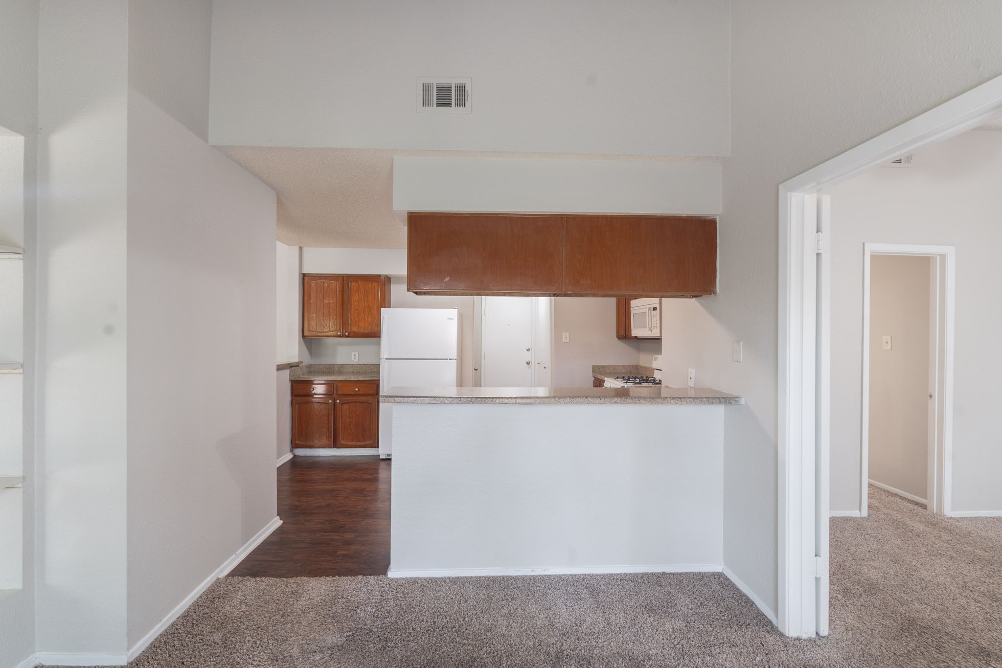 2302 Peaceful Valley Drive Spring, TX 77373 - Photo 11 of 39 a room with wooden floor and a lamp