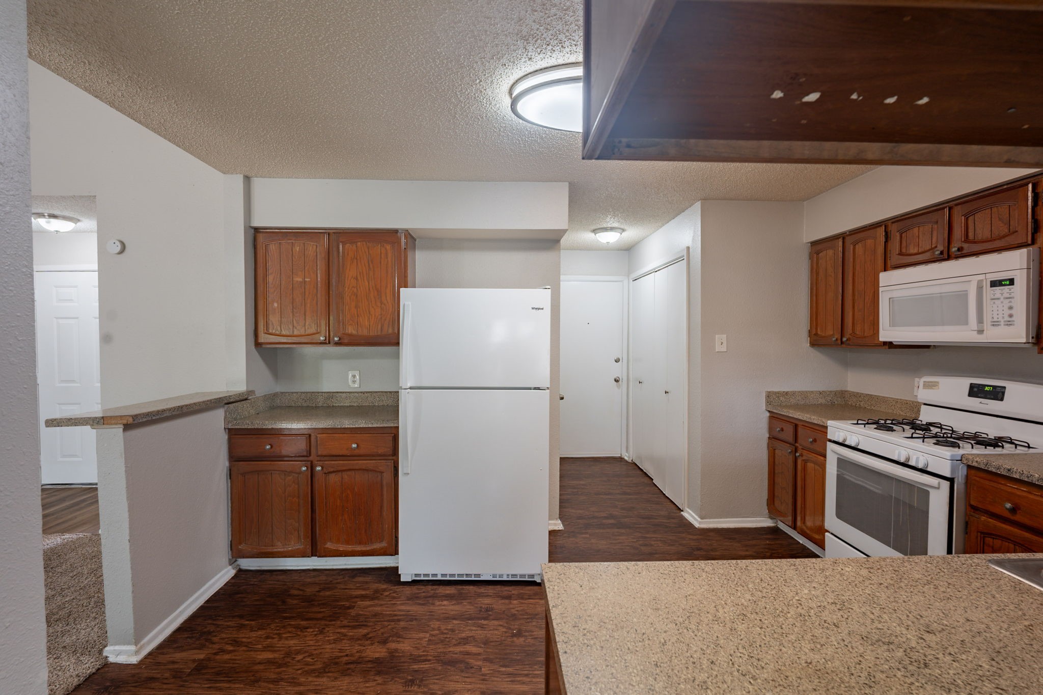 2302 Peaceful Valley Drive Spring, TX 77373 - Photo 16 of 39 a kitchen with stainless steel appliances granite countertop a refrigerator a stove a sink and a microwave