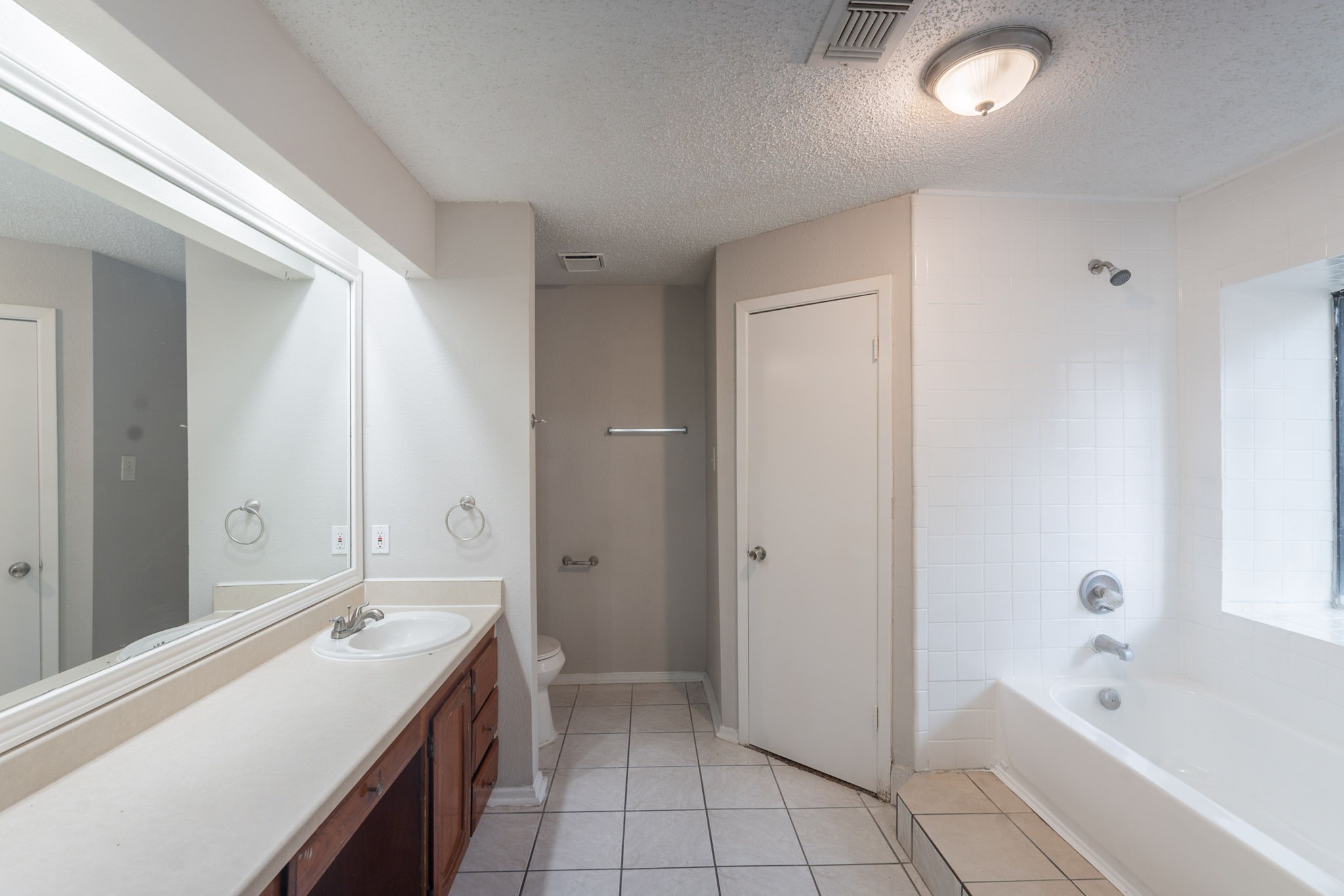 2302 Peaceful Valley Drive Spring, TX 77373 - Photo 21 of 39 a bathroom with a tub sink and mirror