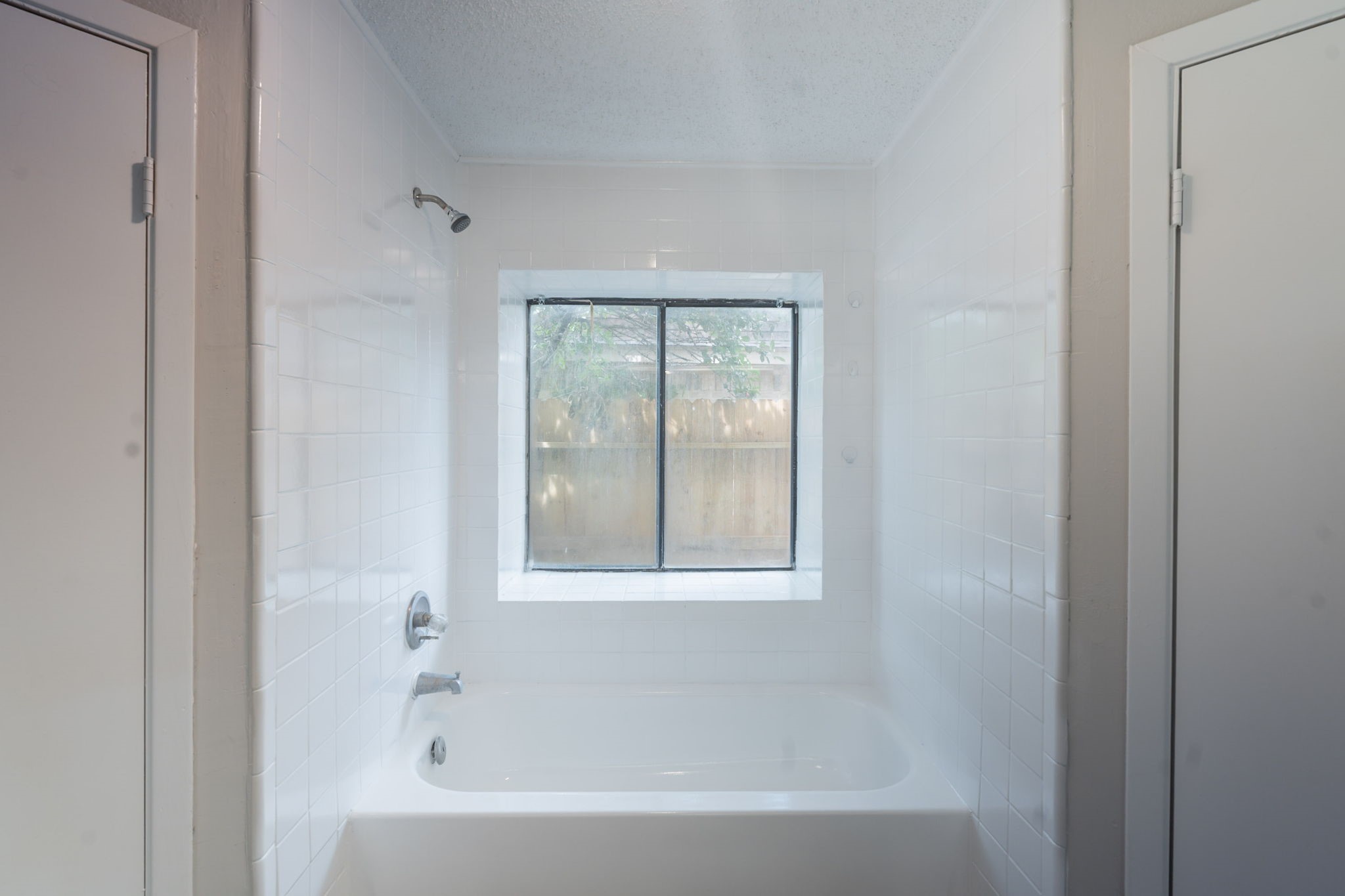 2302 Peaceful Valley Drive Spring, TX 77373 - Photo 23 of 39 a white bath tub sitting next to a window