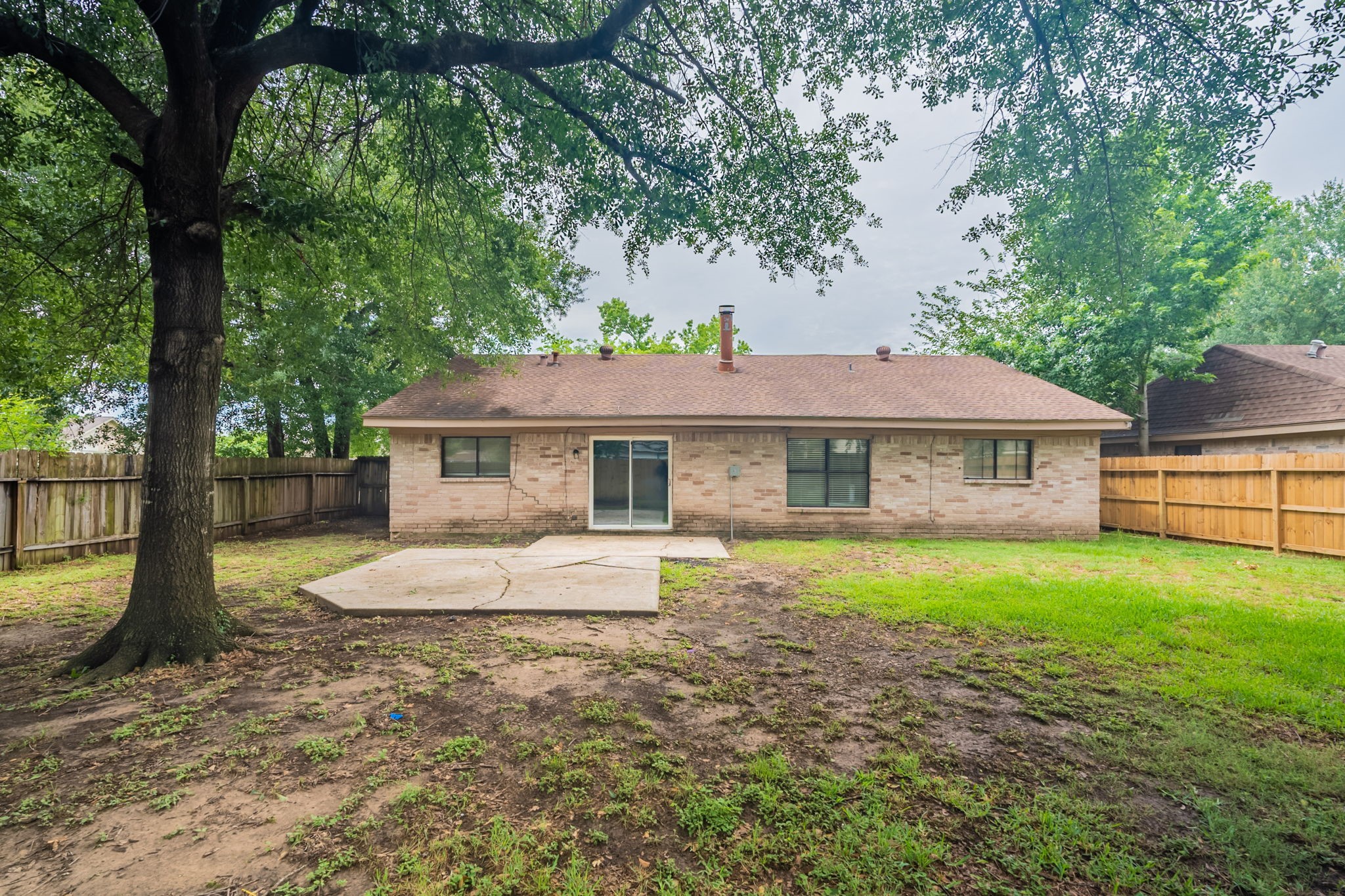 2302 Peaceful Valley Drive Spring, TX 77373 - Photo 36 of 39 a front view of a house with a yard and trees