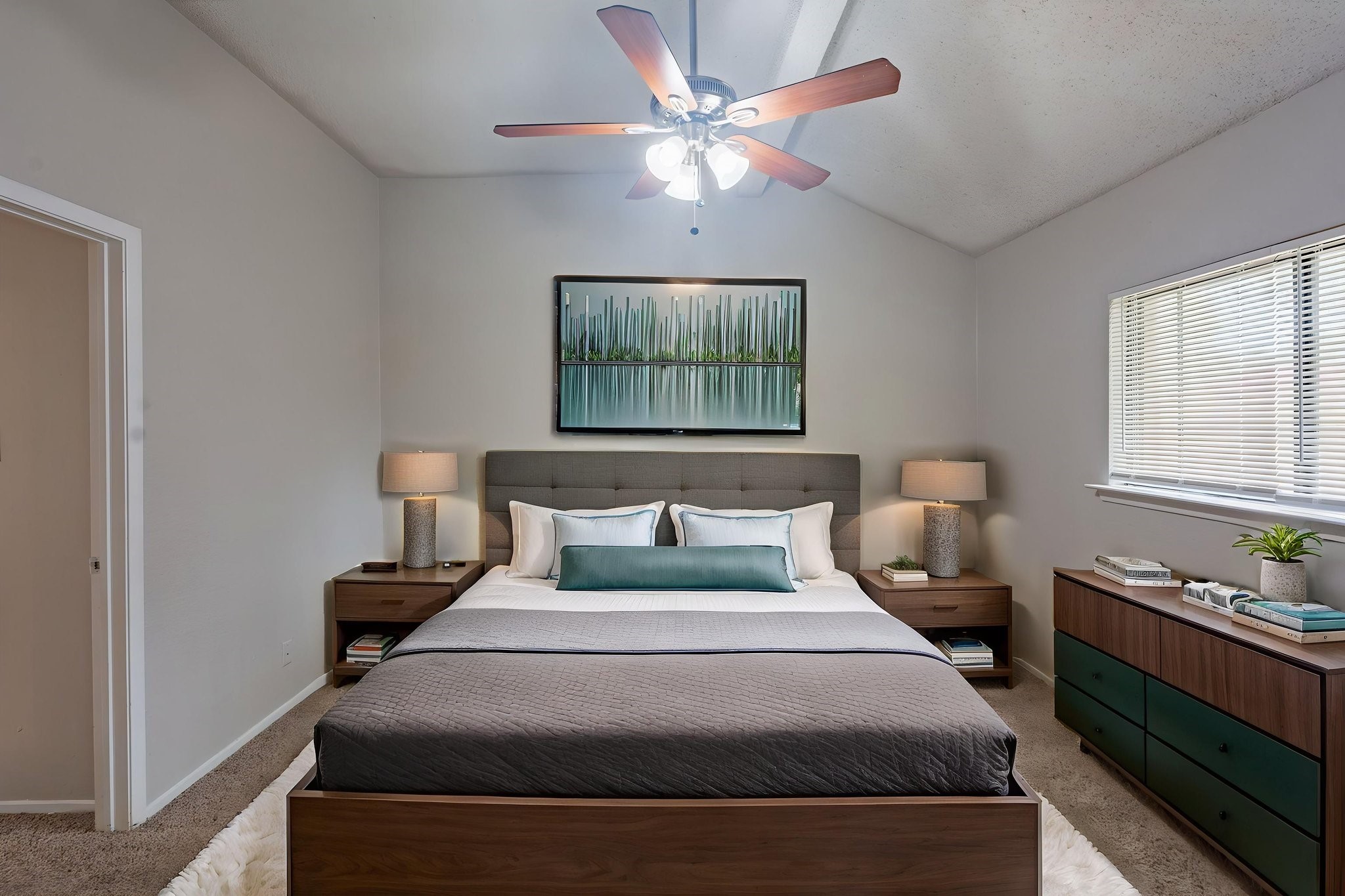 2302 Peaceful Valley Drive Spring, TX 77373 - Photo 6 of 39 a bedroom with a bed and a chandelier