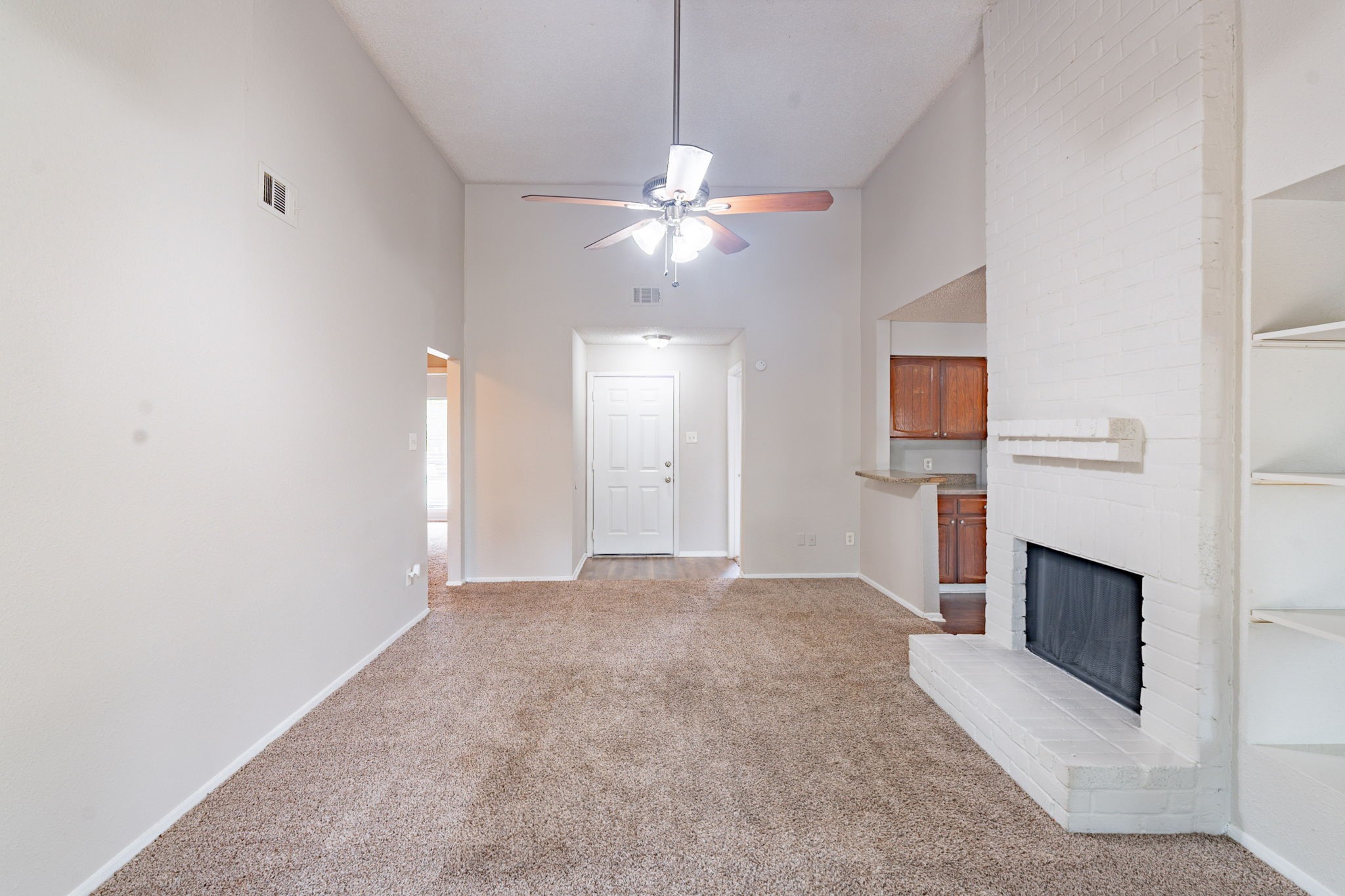 2302 Peaceful Valley Drive Spring, TX 77373 - Photo 8 of 39 a view of an empty room with a fireplace