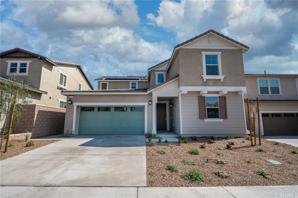 5345 Blue Rdg Way Fontana, CA 92336 - Photo 1 of 1 a front view of a house with a yard and garage