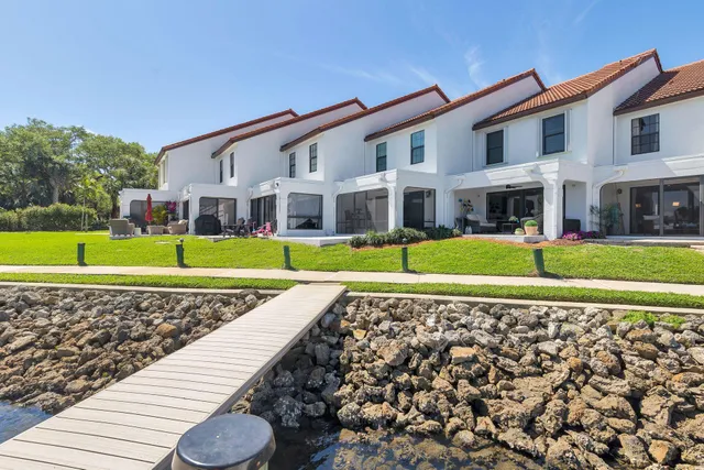 a view of a lake with a houses with outdoor space