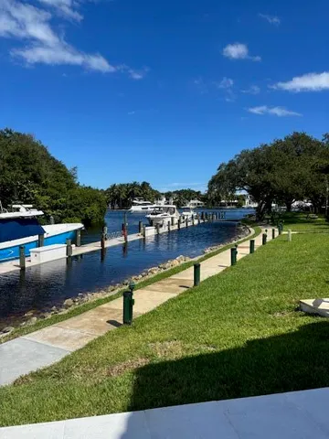 a living room with furniture and large windows