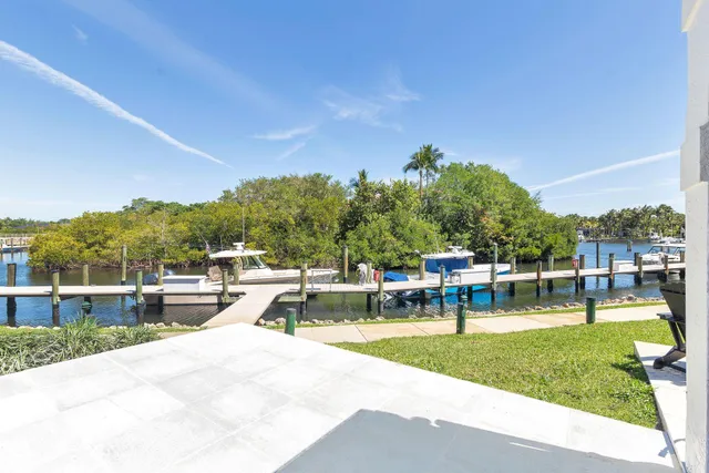 an aerial view of a house with a lake view