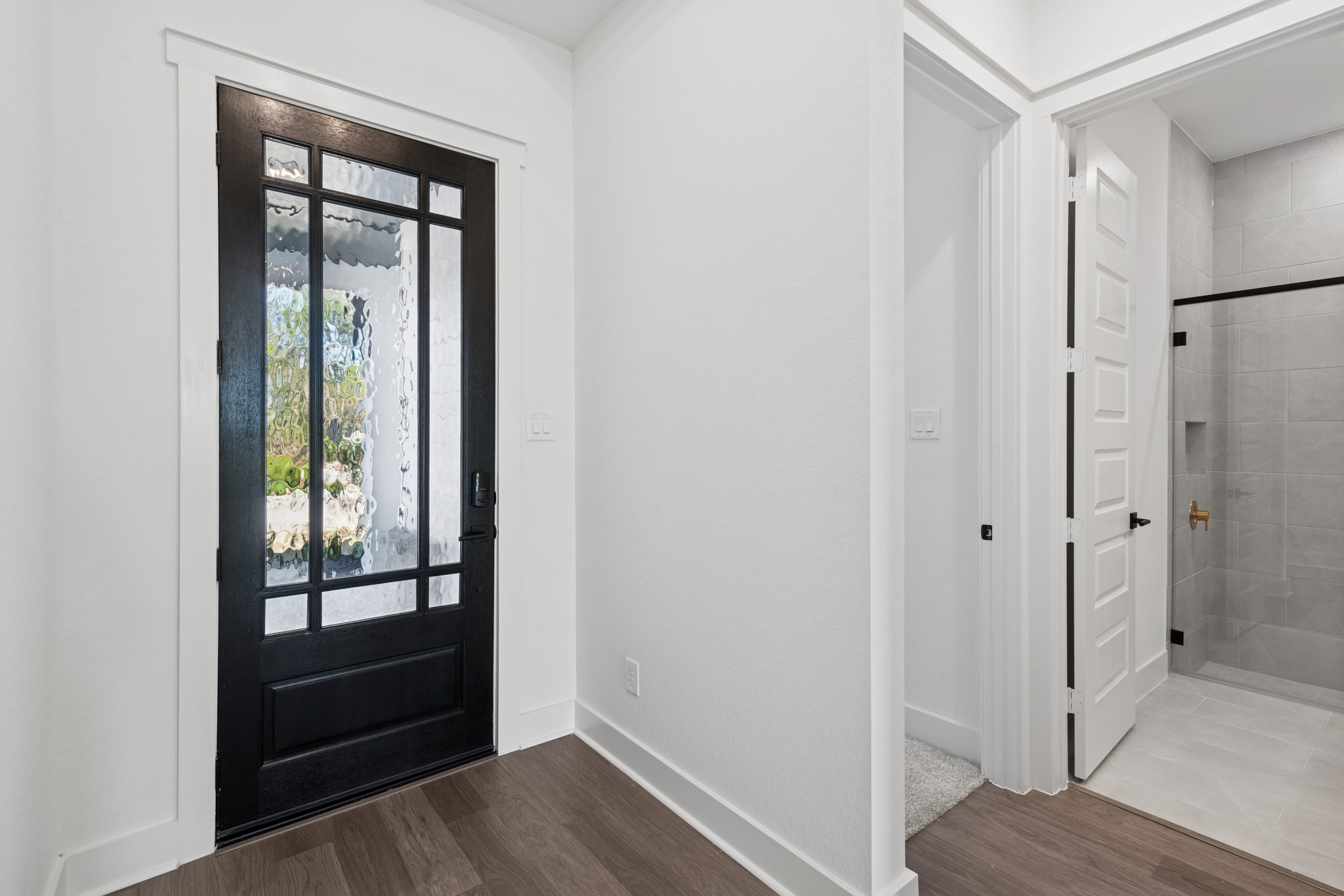16138 Rita Road Conroe, TX 77302 - Photo 13 of 50 a view of walk in closet with wooden floor