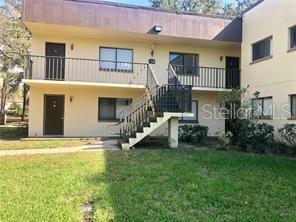 11824 Raintree Lake Lane, Unit A Temple Terrace, FL 33617 - Photo 1 of 1 a view of a house with a swimming pool and a yard with stairs