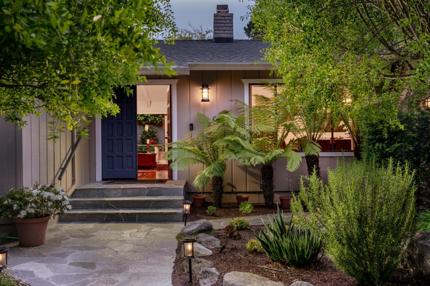 3060 Aztec Road Pebble Beach, CA 93953 - Photo 1 of 38 a front view of a house with a yard