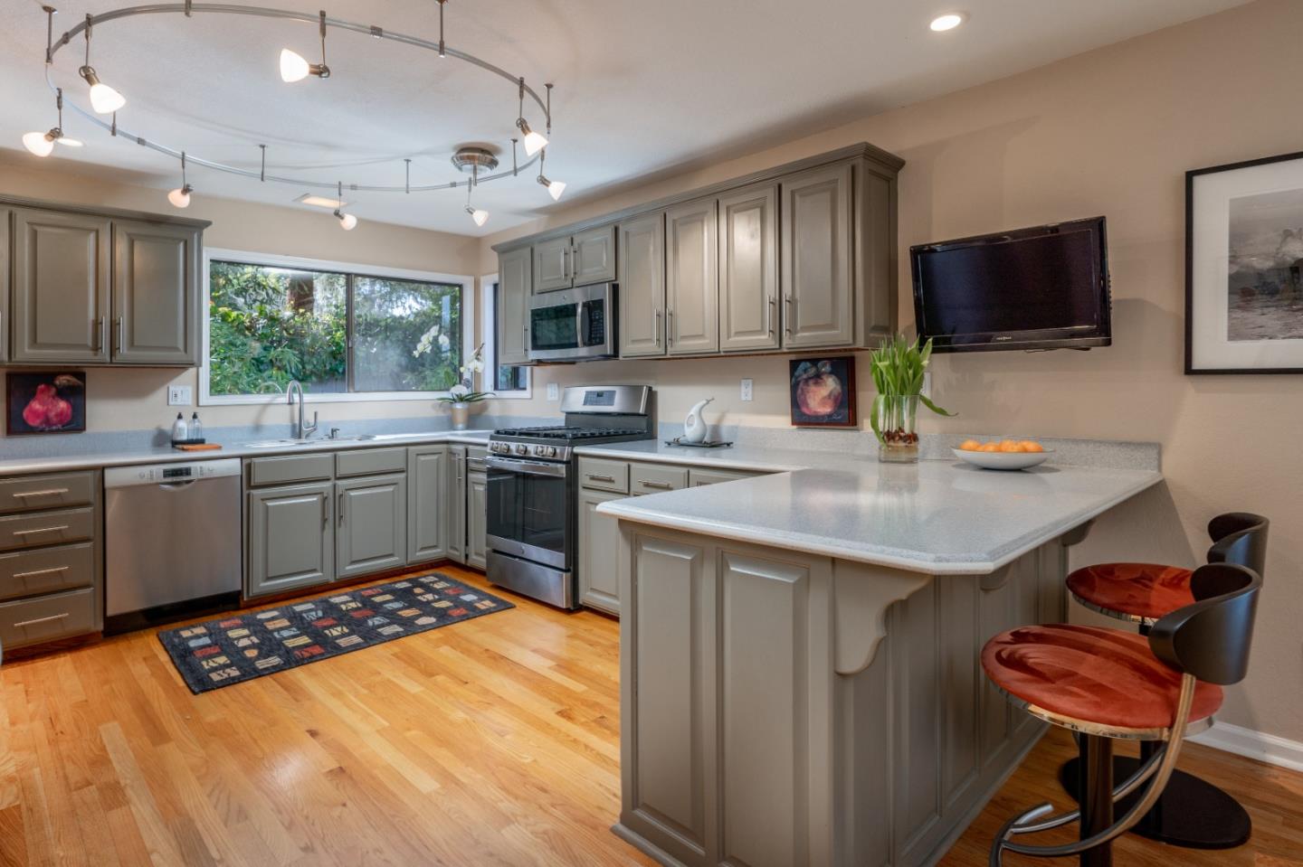 3060 Aztec Road Pebble Beach, CA 93953 - Photo 13 of 38 a kitchen with a sink stove and microwave