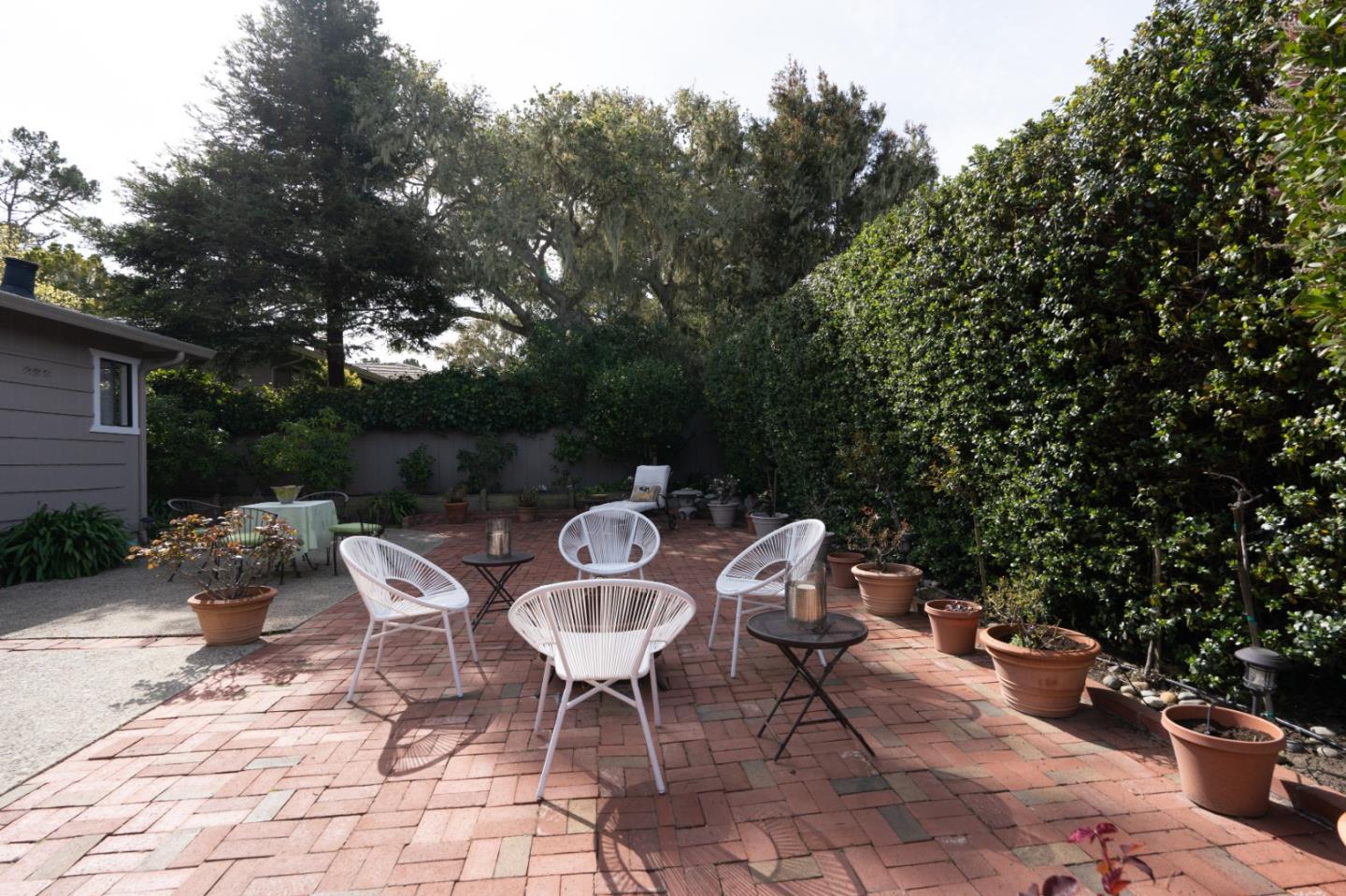 3060 Aztec Road Pebble Beach, CA 93953 - Photo 31 of 38 a table and chairs in a patio