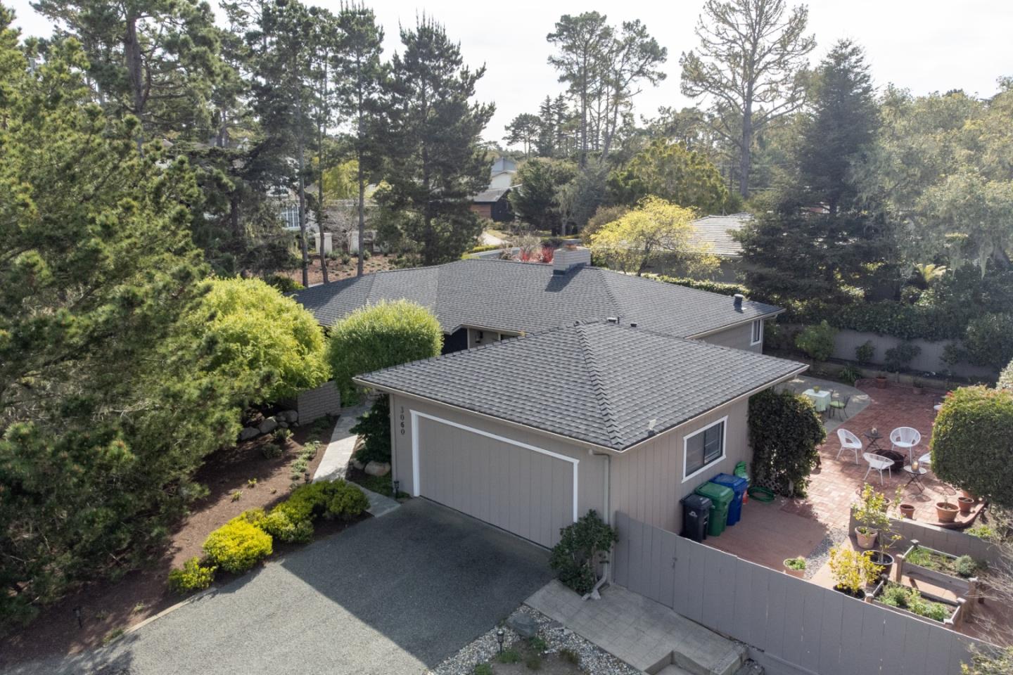 3060 Aztec Road Pebble Beach, CA 93953 - Photo 35 of 38 a view of a house with a yard and large tree
