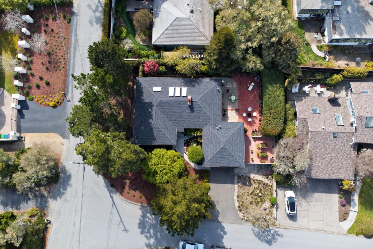 3060 Aztec Road Pebble Beach, CA 93953 - Photo 36 of 38 an aerial view of a house with a garden and a yard