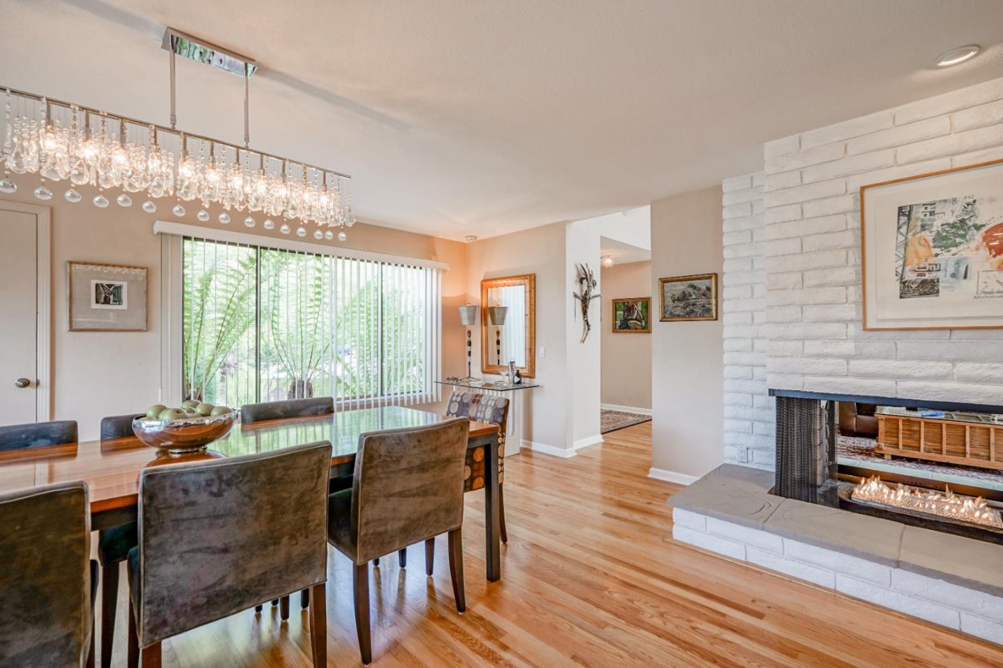 3060 Aztec Road Pebble Beach, CA 93953 - Photo 8 of 38 a view of a dining room with furniture window and wooden floor