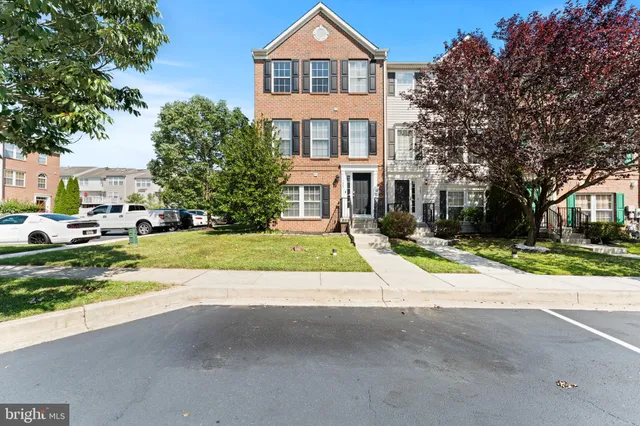 a view of house with yard and green space