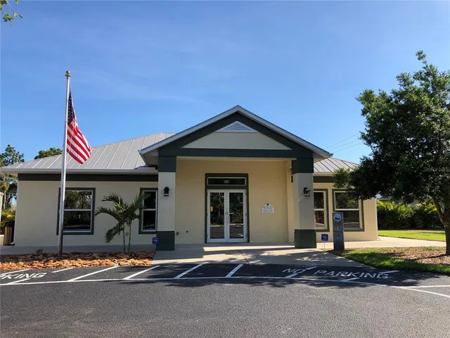 a view of a lake with a house in the background