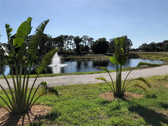 a view of a lake with mountain in background
