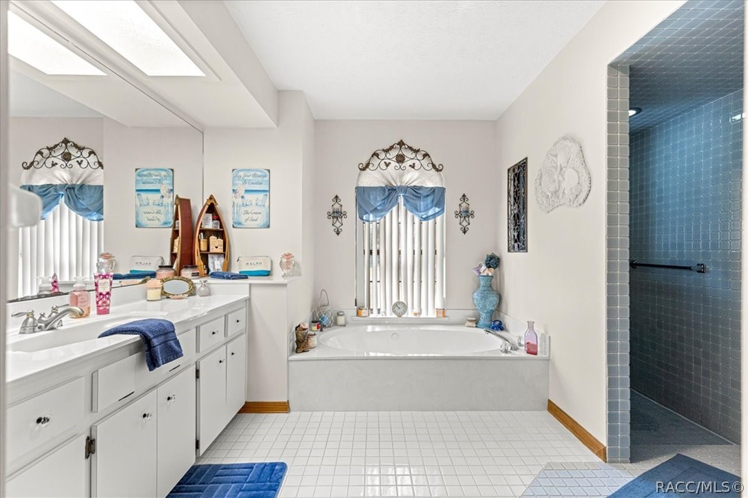2964 South Cygnet Terrace Inverness, FL 34450 - Photo 26 of 67 a bathroom with a tub sink and mirror