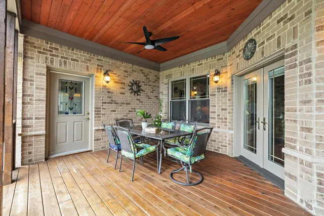 a bedroom with furniture and wooden floor