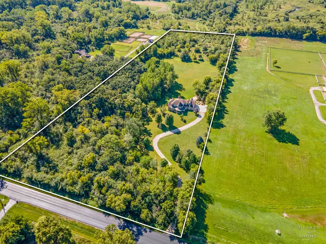 a view of entryway livingroom and hall with wooden floor