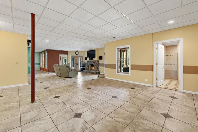 a living room with furniture and large windows