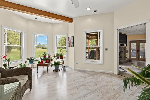 a view of an empty room and a bathroom