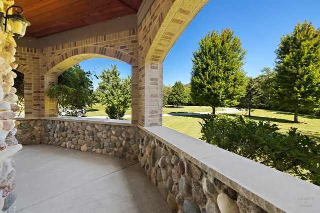 a kitchen with granite countertop stainless steel appliances and wooden cabinets