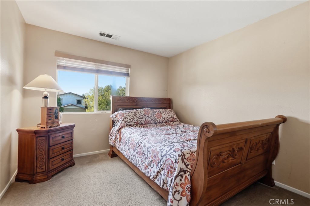 3609 Pyramid Trail Perris, CA 92570 - Photo 20 of 40 a bedroom with a bed and window