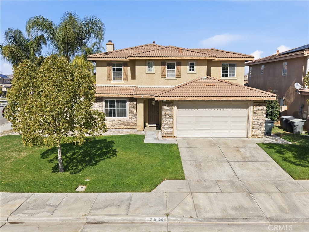 3609 Pyramid Trail Perris, CA 92570 - Photo 2 of 40 a front view of a house with a garden