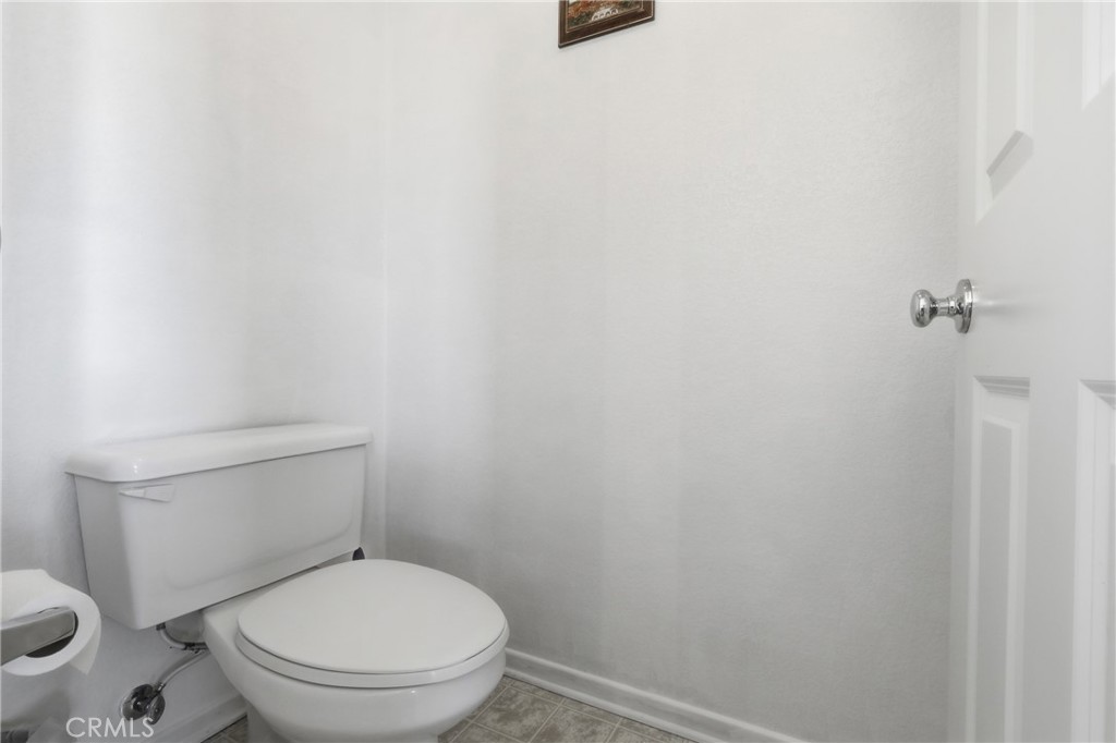3609 Pyramid Trail Perris, CA 92570 - Photo 29 of 40 a white toilet sitting next to a shower