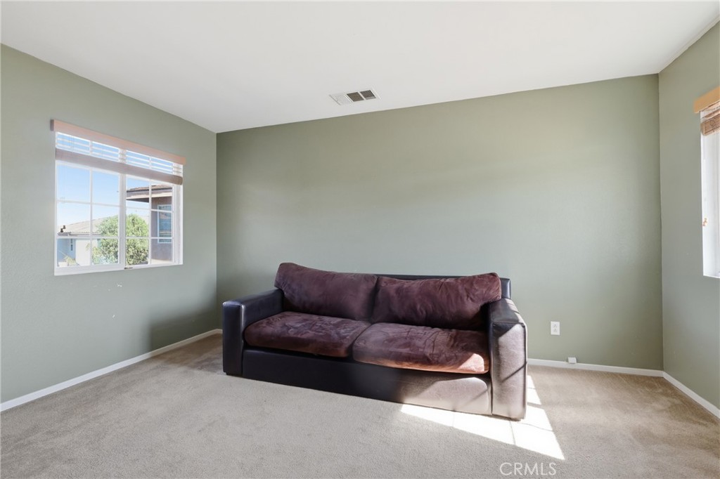 3609 Pyramid Trail Perris, CA 92570 - Photo 30 of 40 a living room with a couch and a window