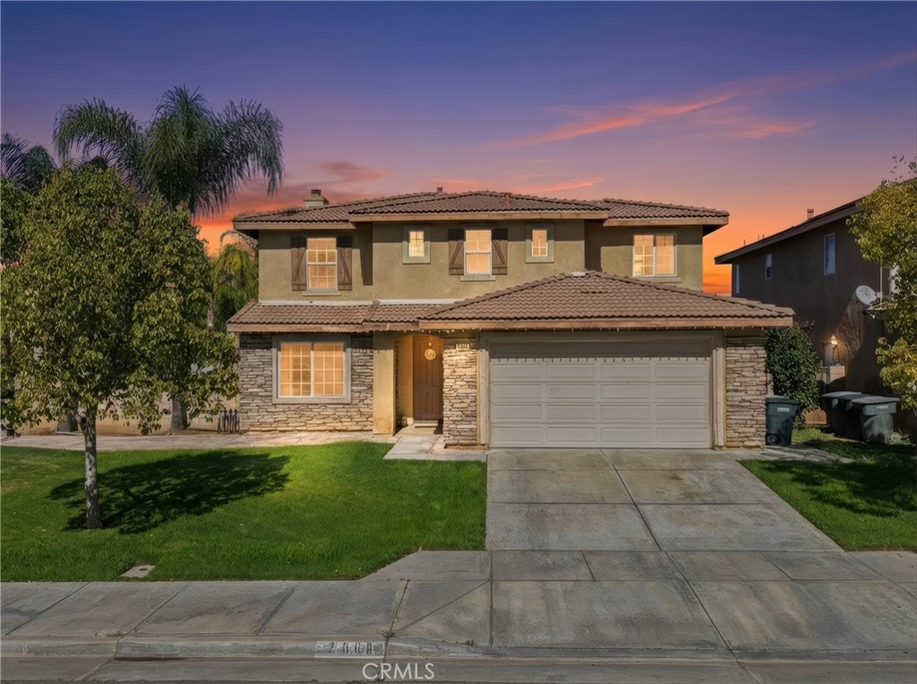 3609 Pyramid Trail Perris, CA 92570 - Photo 40 of 40 a front view of a house with a yard and garage