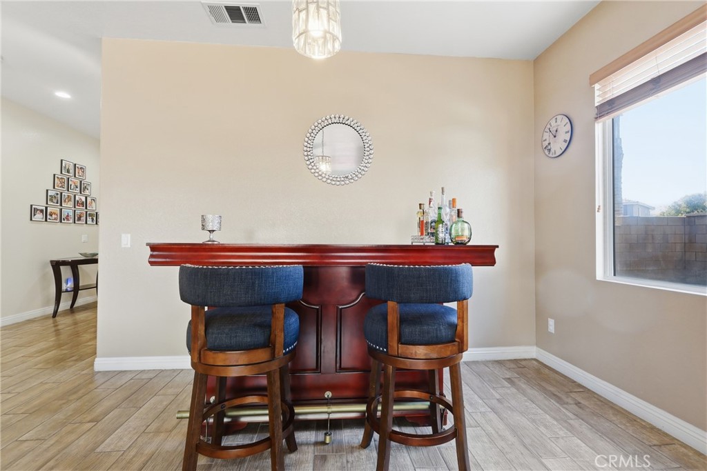 3609 Pyramid Trail Perris, CA 92570 - Photo 10 of 40 a view of a dining room with furniture and wooden floor