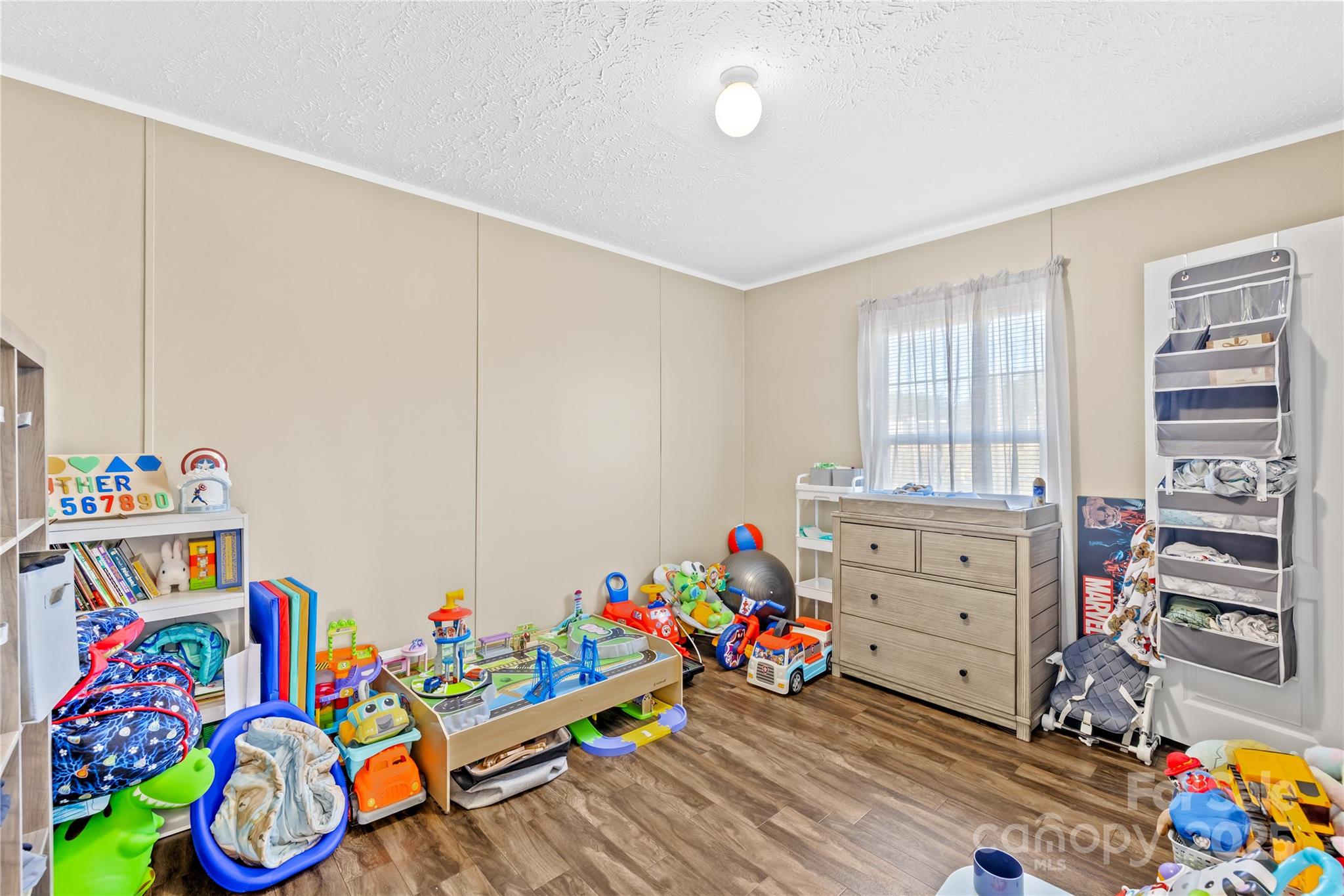 31321 Garrett Way Albemarle, NC 28001 - Photo 11 of 21 a room with toys and two baby crib