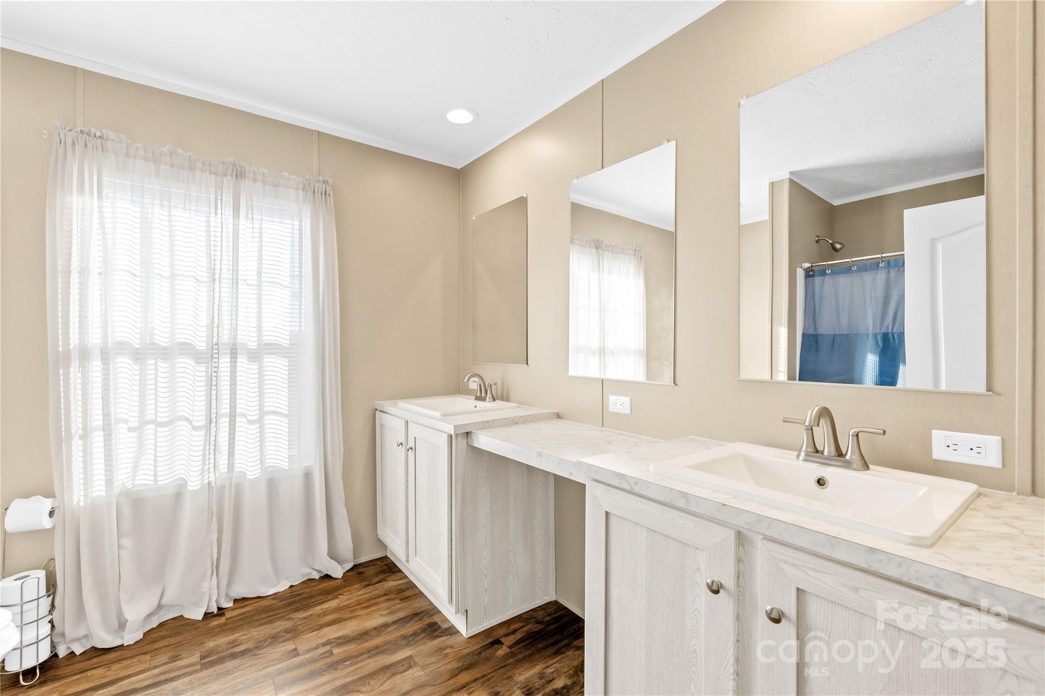 31321 Garrett Way Albemarle, NC 28001 - Photo 12 of 21 a bathroom with a sink and a mirror