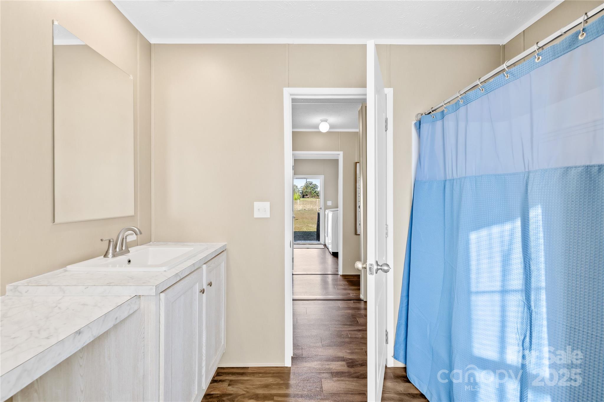 31321 Garrett Way Albemarle, NC 28001 - Photo 13 of 21 a bathroom with a sink and mirror