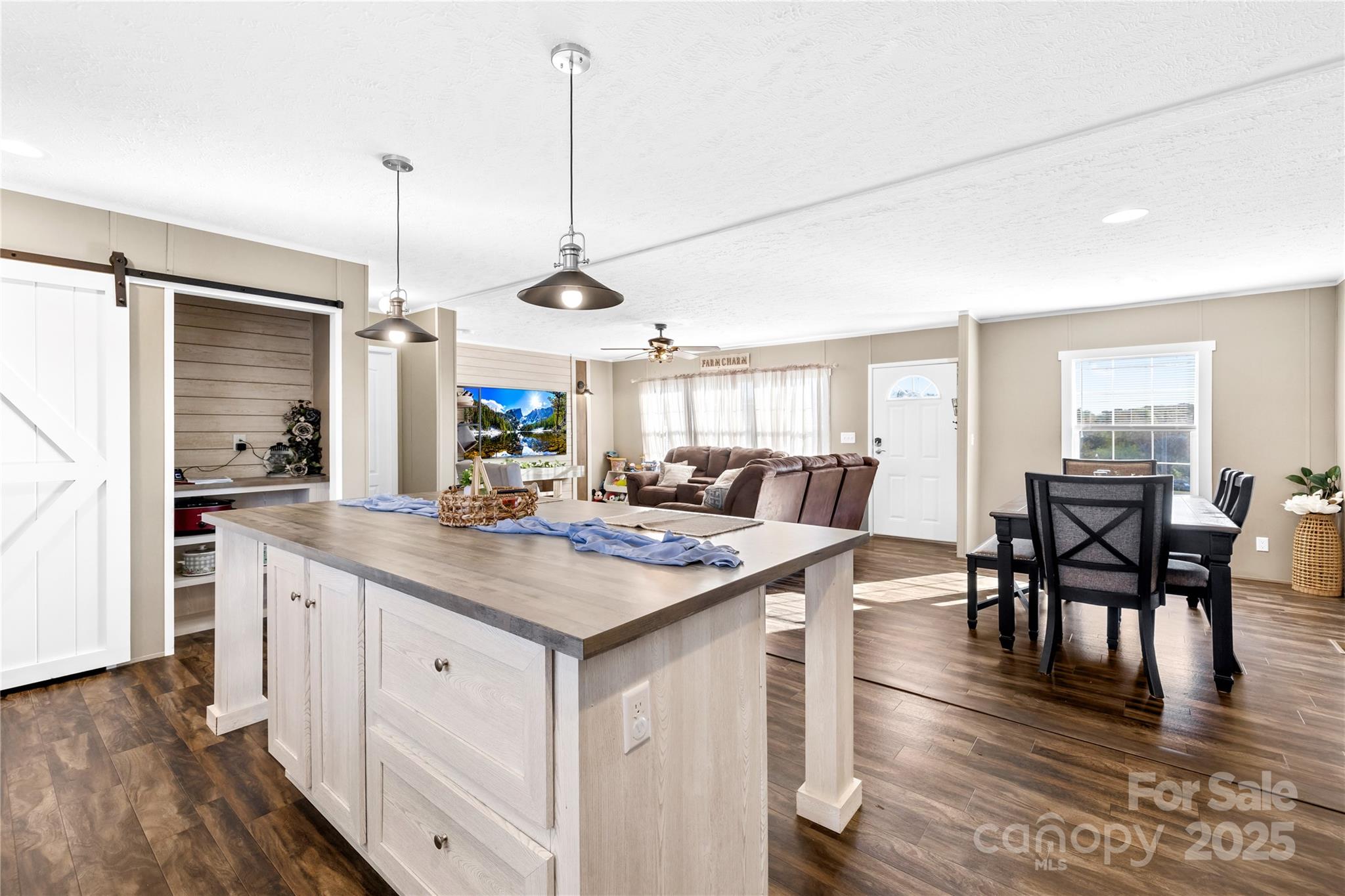 31321 Garrett Way Albemarle, NC 28001 - Photo 2 of 21 a view of dining table chairs and wooden floor