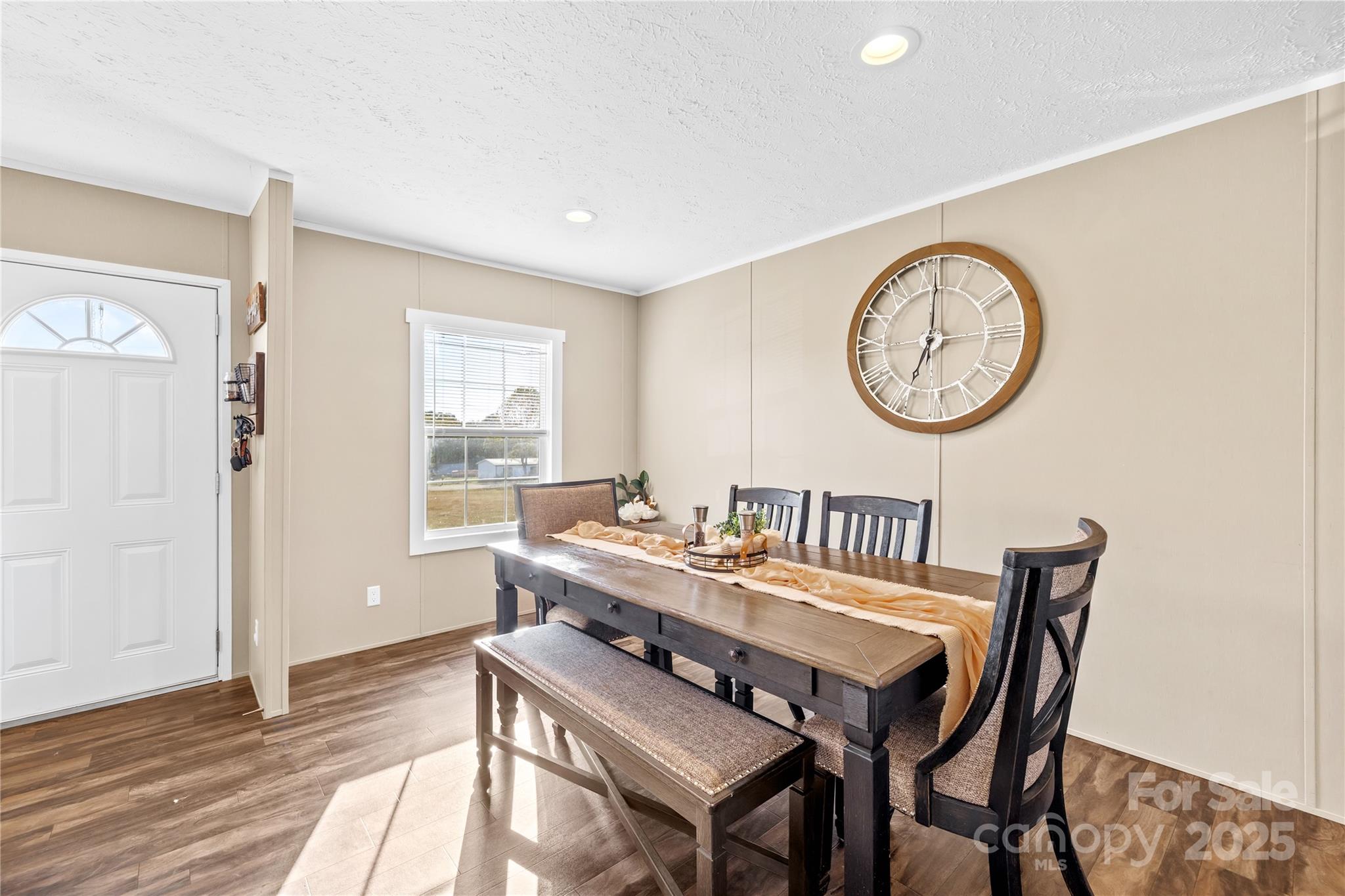 31321 Garrett Way Albemarle, NC 28001 - Photo 4 of 21 a view of a dining room with furniture window and wooden floor