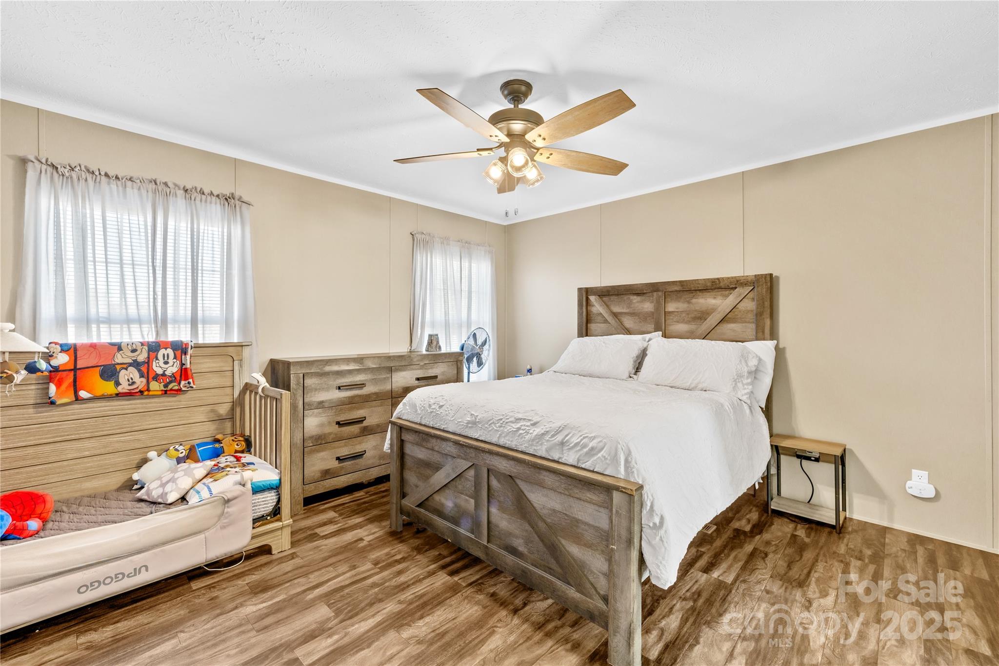 31321 Garrett Way Albemarle, NC 28001 - Photo 8 of 21 a bedroom with a bed and a chandelier