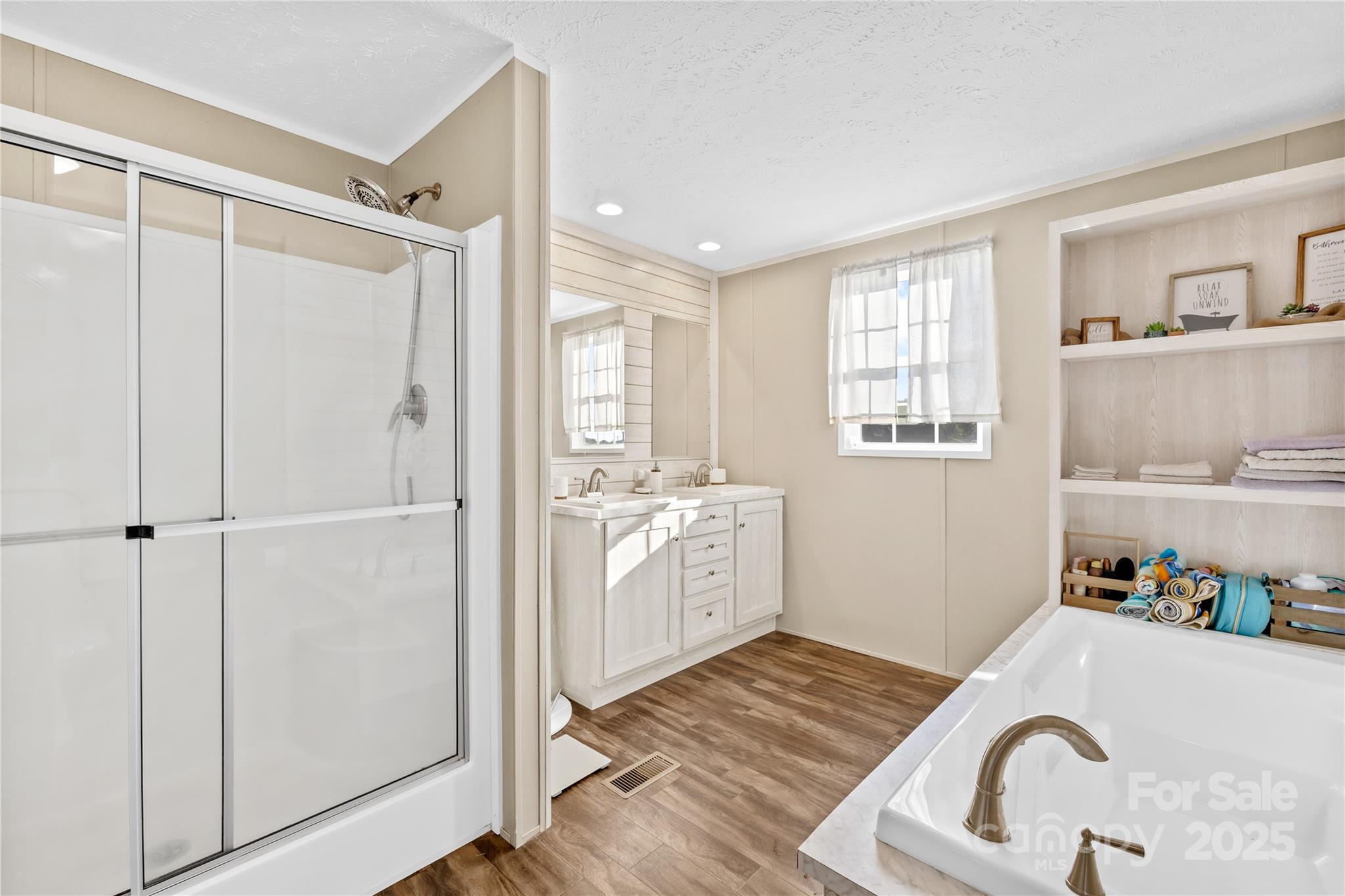 31321 Garrett Way Albemarle, NC 28001 - Photo 10 of 21 a bathroom with a sink and a mirror