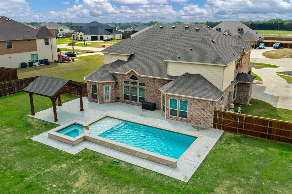 an aerial view of a house having swimming pool garden and patio