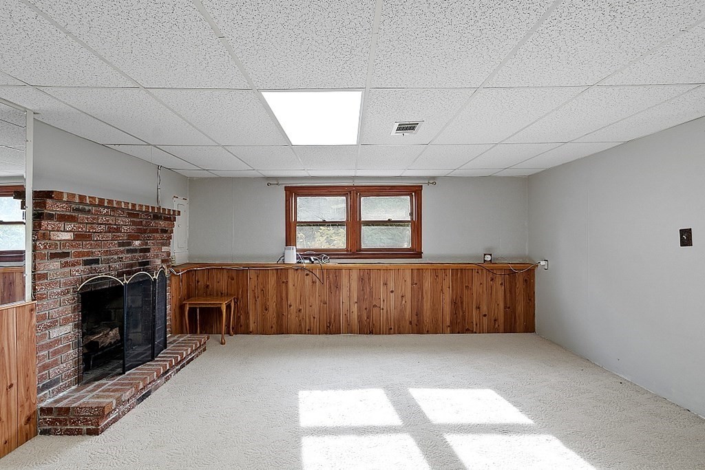 97 Riverview Boulevard Methuen, MA 01844 - Photo 18 of 30 a view of a livingroom with furniture and a fireplace