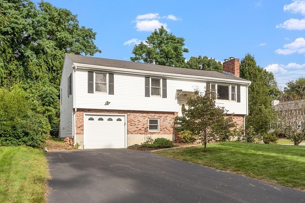 97 Riverview Boulevard Methuen, MA 01844 - Photo 22 of 30 front view of a house with a yard