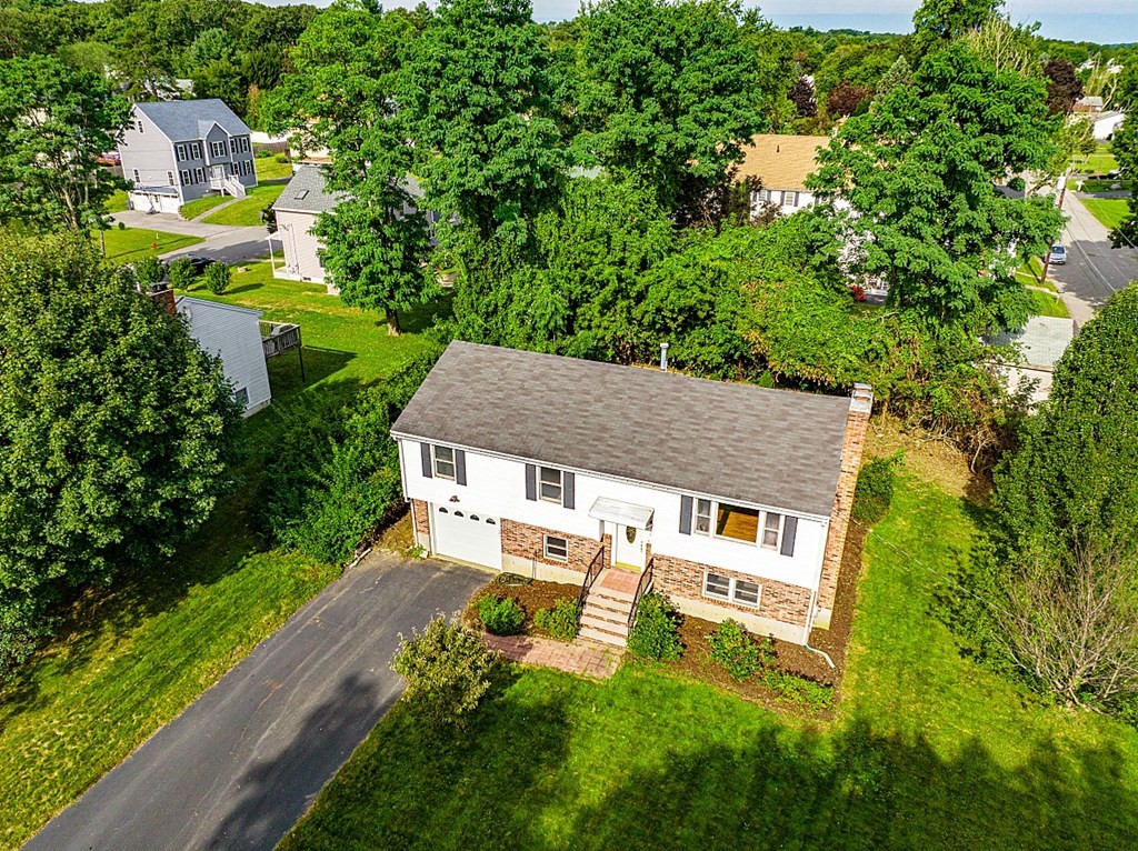 97 Riverview Boulevard Methuen, MA 01844 - Photo 27 of 30 a aerial view of a house with a yard table and chairs