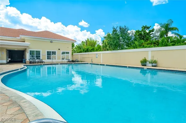 a view of a patio with a swimming pool