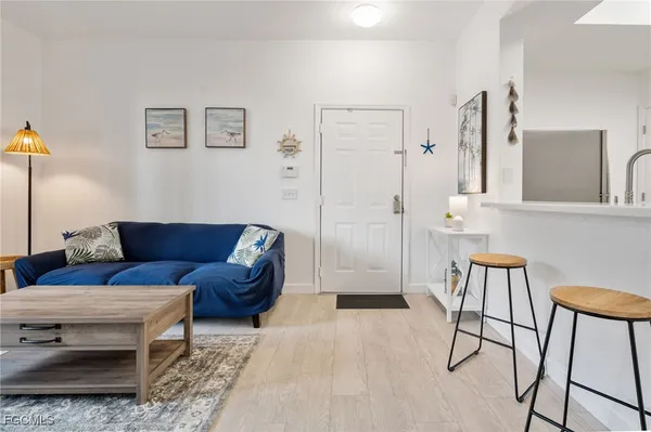 a living room with furniture and a rug